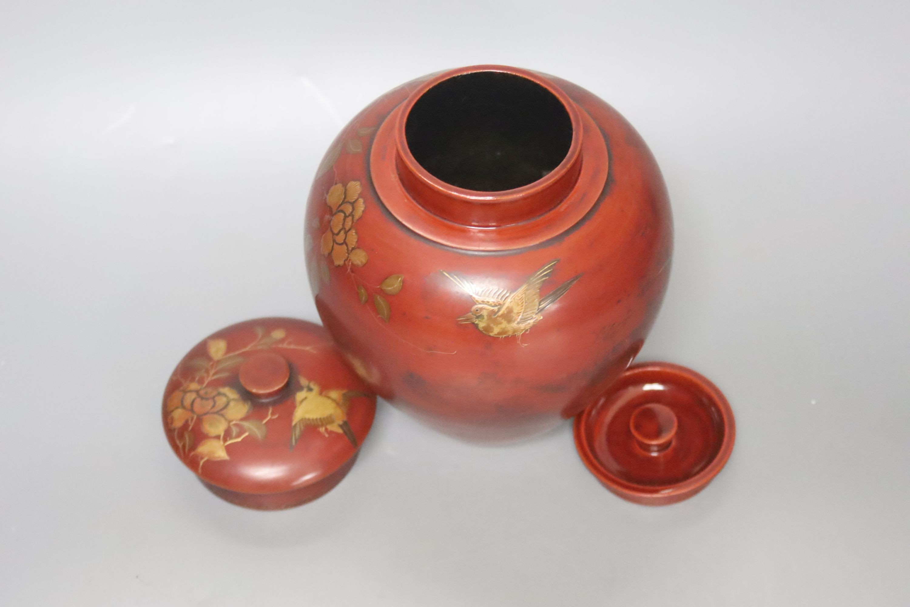 A Chinese red lacquer tobacco jar and cover, height 18cm